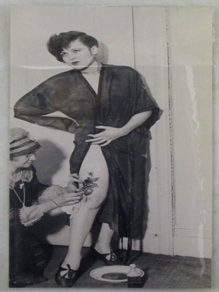 Item #022021 Photograph of a Young Woman receiving an applique tattoo to her leg. Tattoos